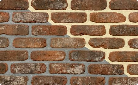 Weathered dark tumbled york brick
